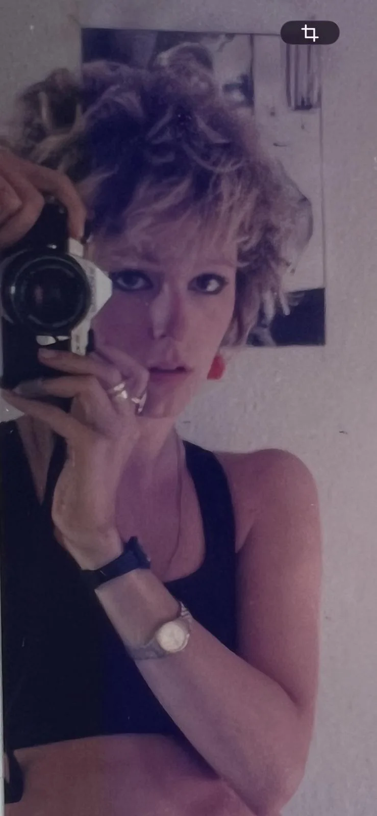 MODEL — archival portrait with camera